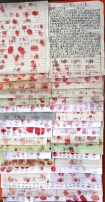 Bild på en petition med 2000 underskrifter i november 2012 för Falun Gong-utövaren He Jincui från staden Chengzhou i Hunanprovinsen i södra Kina. ”Har kommunistpartiet gripit ännu en Falun Gong-utövare?” frågade en kvinna när hon skrev på. ”Skynda er att hitta fler människor som kan skriva på för hennes räddning.”