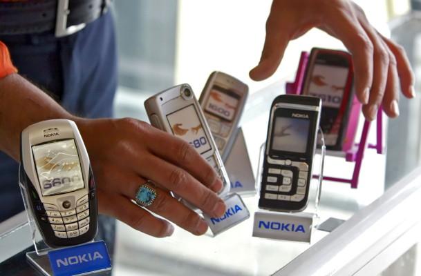 Den spiondömnde använde bl.a mobiltelefon med kontantkort för att vidarebefodra sin information till den kinesiska staten. (Foto: AFP/Sabah Arar) 