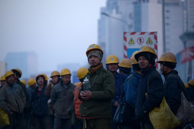 Kinesiska arbetare i Peking den 28 december 2015. (Foto: Wang Zhao /AFP/Getty Images)