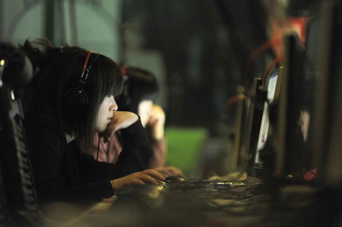 En rapport från undersökningsgruppen Flashpoint visar att kinesiska internetbrottslingar håller på att utveckla sin verksamhet och bli mer globala. Personerna på bilden har inget med artikeln att göra. (Foto: Gou Yige/AFP/Getty Images) 