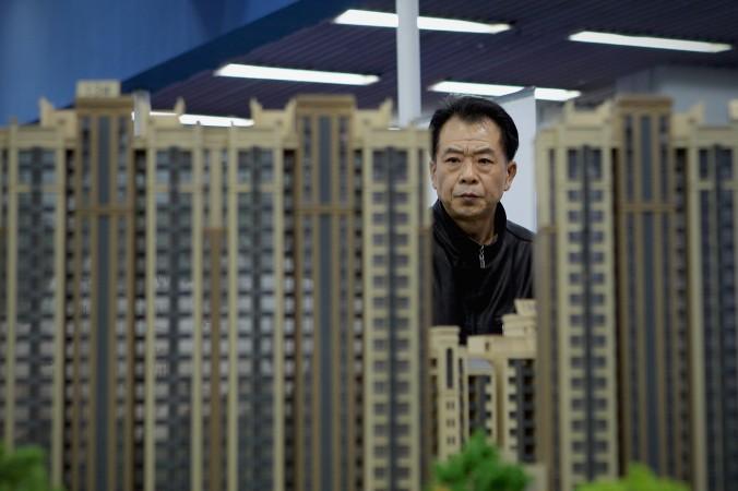 Modeller på fastigheter som ska byggas i Peking. Ekonomen Fan Di menar att Kinas heta fastighetsmarknad är en lekplats för de rika, som inte stärker, utan rentav skadar den reala ekonomin. (Foto: Lintao Zhang /Getty Images)