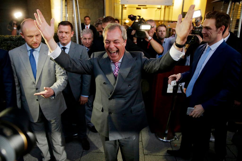 Nigel Farage, the leader of the UK Independence Party celebrates and poses for photographers as he leaves a "Leave.EU" organization party for the British European Union membership referendum in London, Friday, June 24, 2016. On Thursday, Britain voted in a national referendum on whether to stay inside the EU. (AP Photo/Matt Dunham)