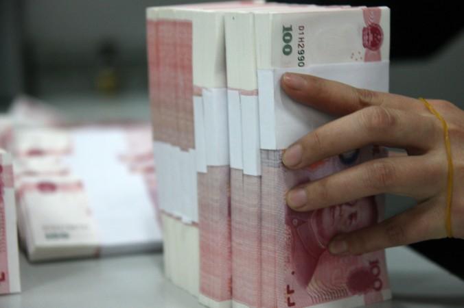 Enligt den amerikanska investmentbanken Goldman Sachs är det verkliga budgetunderskottet i Kina betydligt större än Peking vill visa. (Foto: ChinaFotoPress /Getty Images)