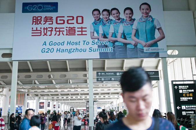 Reklamplakat för det kommande G20-mötet på flygplatsen i Hangzhou i Kina. Invånarna hålls i strama tyglar av myndigheterna under den vecka mötet pågår. (Fred Dufour/AFP/Getty Images)
