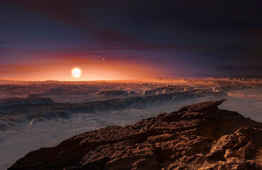 En rekonstruktion av hur den nyupptäckta planeten Proxima b kan tänkas se ut på ytan. I bakgrunden syns den röda dvärgstjärnan Proxima Centauri, den närmaste grannen till vår egen sol i Vintergatan. (Foto: M. Kornmesser.)