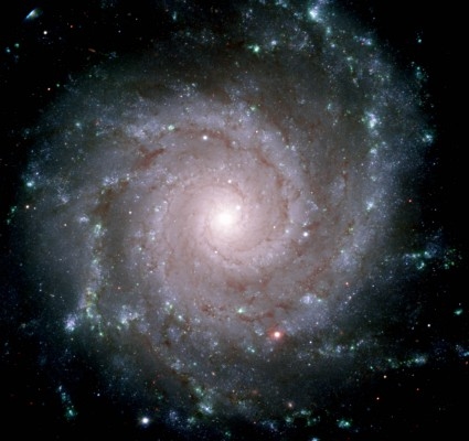 Ända sedan Demokritos lade fram hypotesen om atomens existens och ”odelbara partiklar” för över två tusen år sedan har människan utforskat och grubblat över universums grundläggande grundstenar. På bilden syns galaxen NGC 628 som finns i stjärnbilden fiskarna. (Foto: AFP/Geminiobservatoriet)