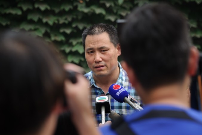  Kinas omfattande fängslande av människorättsaktivister upprör Freedom House. På bilden, tagen 2012, talar advokaten  Pu Zhiqiang med pressen. Han har företrätt personer som drabbats av statens rättsliga kränkningar. Nu kan han inte längre hjälpa dem på grund av att han hålls fängslad av myndigheterna. (Foto: Ed Jones/AFP/Getty Images)