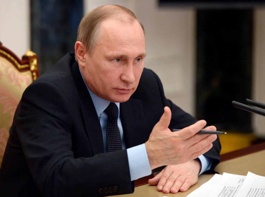 Rysslands president Vladimir Putin kan tvingas rädda landets skuldtyngda regioner med nödlån. (Foto: Alexei Nikolsky AP/TT-arkivbild)