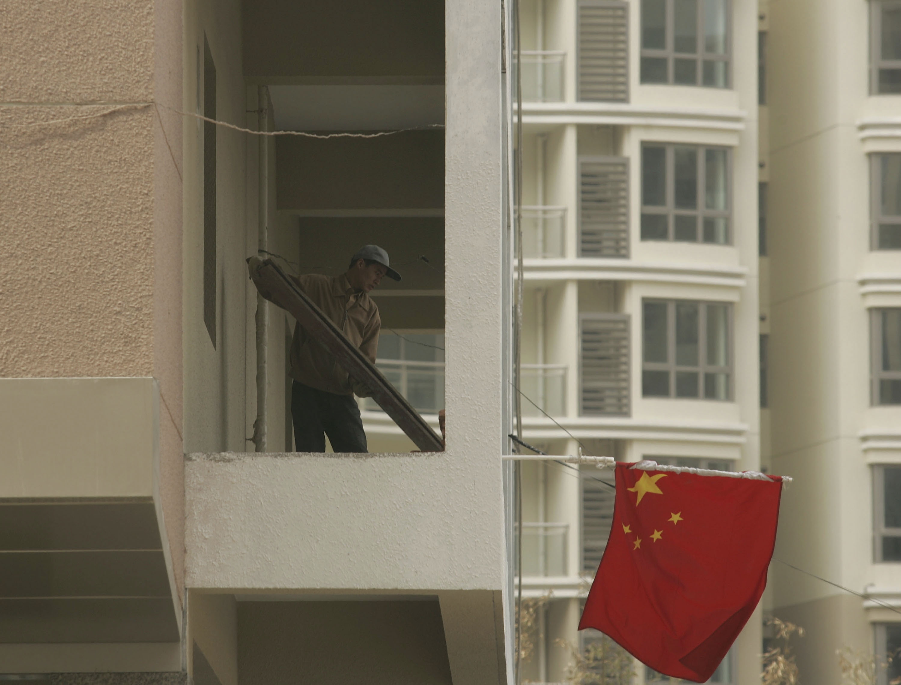 China Beige Book är en kvartalsrapport som är utformad från intervjuer med tusentals företagare i Kina, därigenom får man annan information än den officiella statistiken. (Foto: Photo by China Photos/Getty Images)