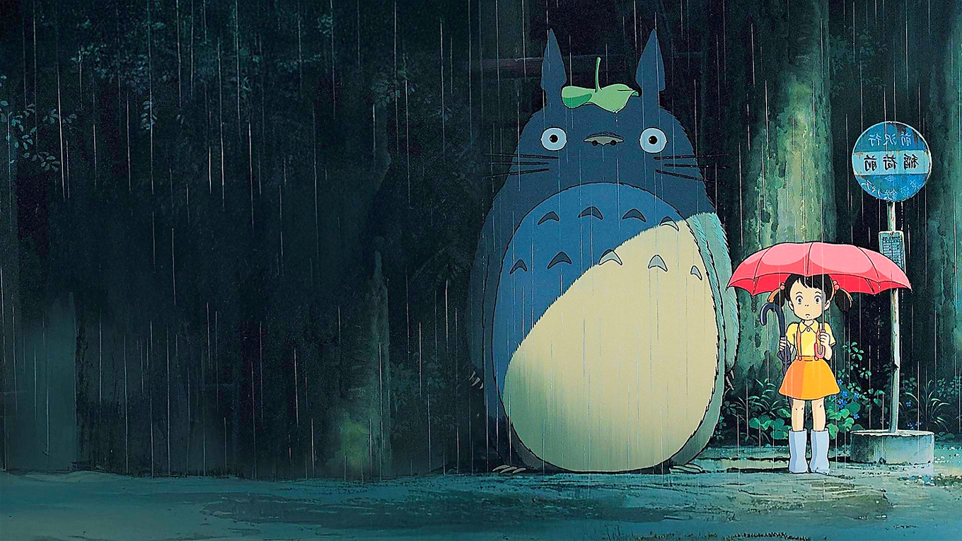 Vänliga skogsanden Totoro väntande på Kattbussen tillsammans med en av döttrarna i familjen Kusakabe. Foto: TriArt Film/Studio Ghibli