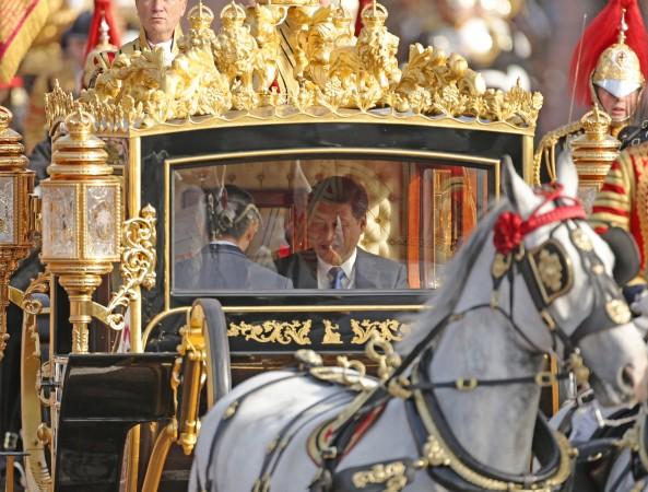 Kinas ledare Xi Jinping får ett kungligt mottagande i Storbritannien . Kinesiska medier jublar, men västerländska analytiker är kritiska. (Yui Mok/WPA Pool/Getty Images)