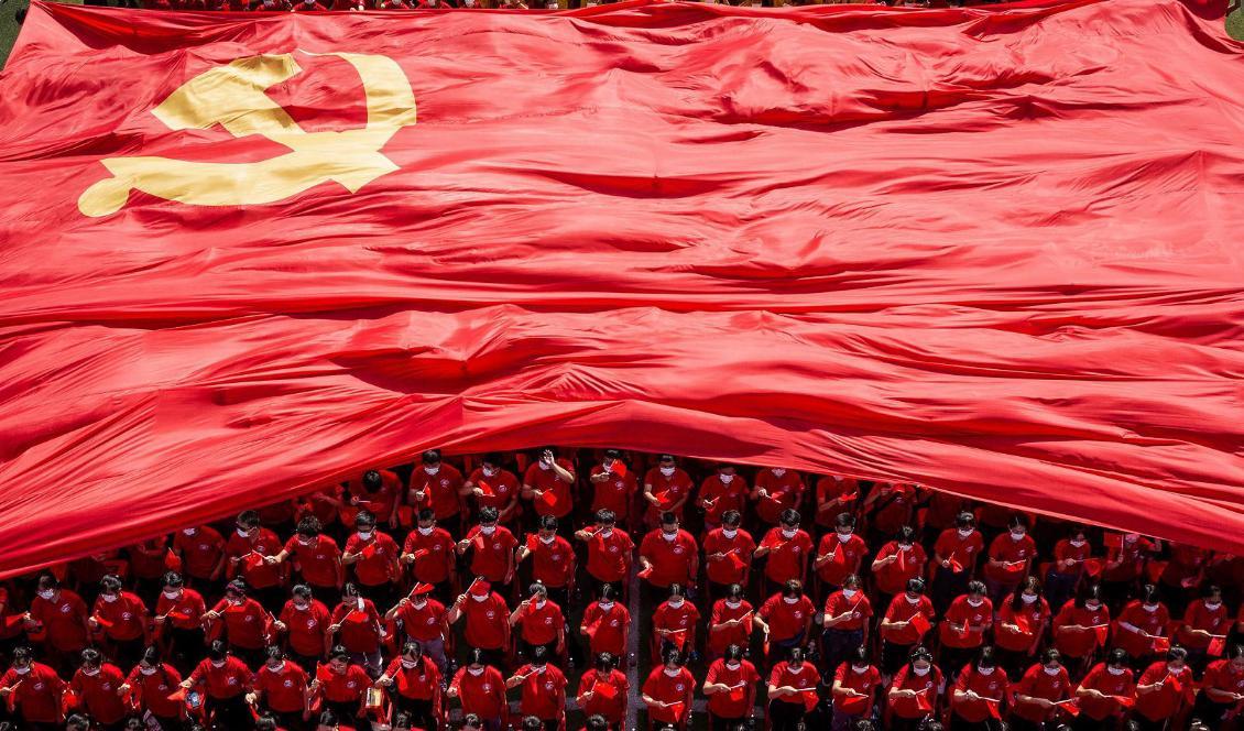 
Universitetsstudenter i Wuhan firar KKP:s 100-årsjubileum vid universitets öppningscermoni för terminen. Den 10 september 2021.
STR/AFP via Getty Images                                            