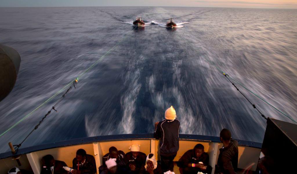 Migranter på en båt som kom till undsättning utanför Libyens kust. Arkivbild. Foto:
Emilio Morenatti/AP/TT