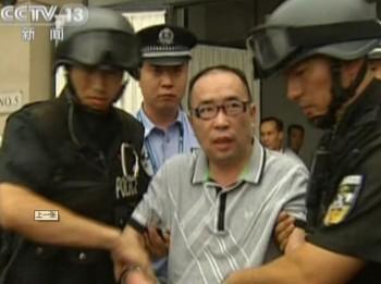 Skärmdump från TV-sändning, den 23 juli 2011. Lai Changxing, den mest efterspanade mannen i Kina och en mycket framgångsrik smugglare, dömdes till livstids fängelse. (Foto: STR / AFP / Getty Images)