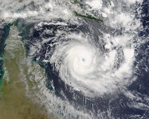 Den tropiska cyklonen Ingrid närmar sig halvön Cape York i Australien, kl 03.00 Greenwich-tid den 7 mars 2005. I en statlig rapport i Australien har man funnit att kuststäderna och turistorterna i Australien står inför stora risker på grund av den destruktiva effekten från klimatförändringar som resulterar i allvarliga stormar. (Foto: MODIS Rapid Response Project at NASA/GSFC/Getty Images)
