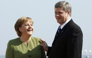 Den tyska förbundskanslern Angela Merkel och Kanadas premiärminister Stephen Harper tackade nej till OS-invigningen. (Michael Kappeler/AFP/Getty Images)