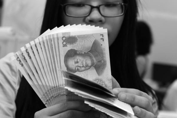 Revisionen för 2013 års utgifter och inkomster inom 38 centrala sektorer i Kina visade miljardbelopp i illegala inkomster, enligt statliga kinesiska medier. (Foto: Sam Yeh/AFP/Getty Images)