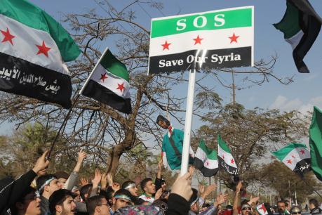 Syrianer bosatta i Egypten demonstrerade i Kairo, söndagen 8 januari, under mötet som  Arabförbundets utrikesministrar hade där. (Foto: Khaled Desouki /AFP)
