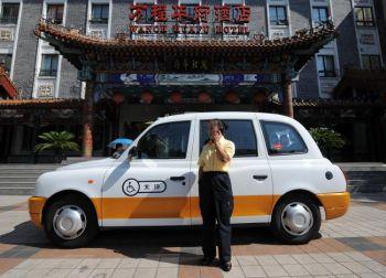 För närvarande är 70 000 taxibilar i Peking utrustade med en "mikroövervakare". Den är kopplad till ett GPS-system via satellit. (Foto: Getty Images)