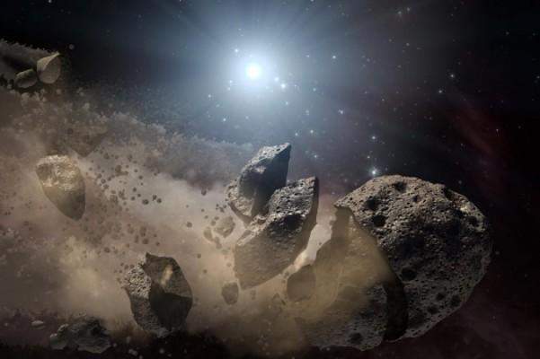 Asteroiden 1950 DA kan komma att träffa jorden om 700 år. Bilden är en illustration av en asteroid som splittras. (NASA)
