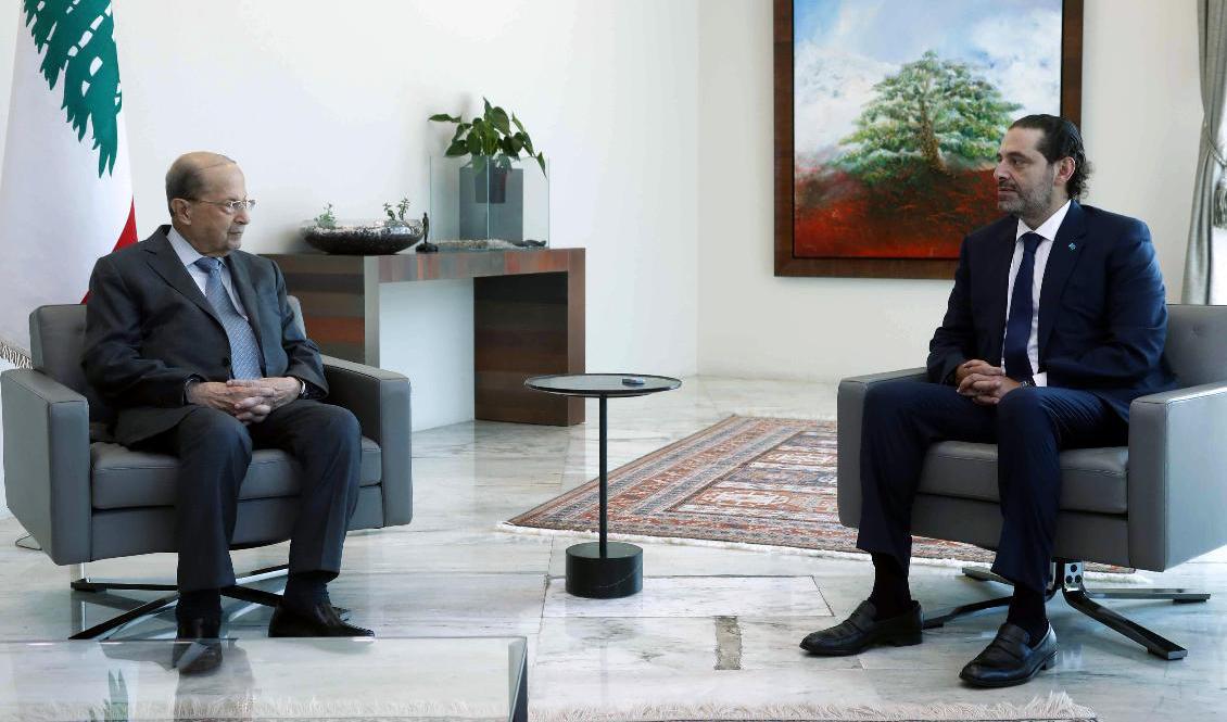 Mötet mellan Saad Hariri och president Michel Aoun uppges bara ha varat 20 minuter. AP via Dalati Nohra, Foto: Libanons regering/TT