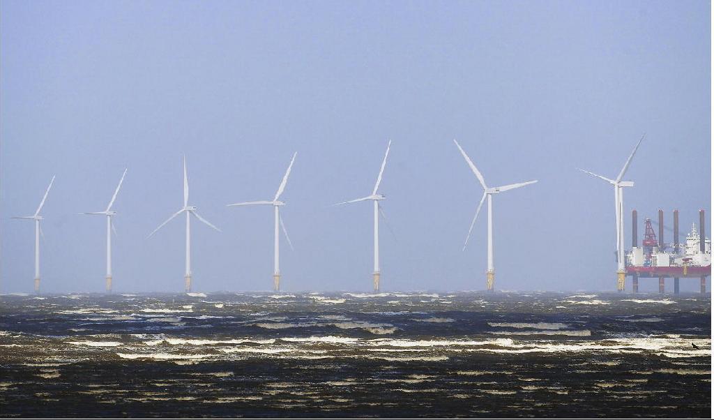 Havsvindkraftparken Burbo Bank Offshore Wind Farm i nordvästra England. FN:s expertgrupp kräver nu ökad takt i klimatarbetet. Foto: Paul Ellis/AFP via Getty Images