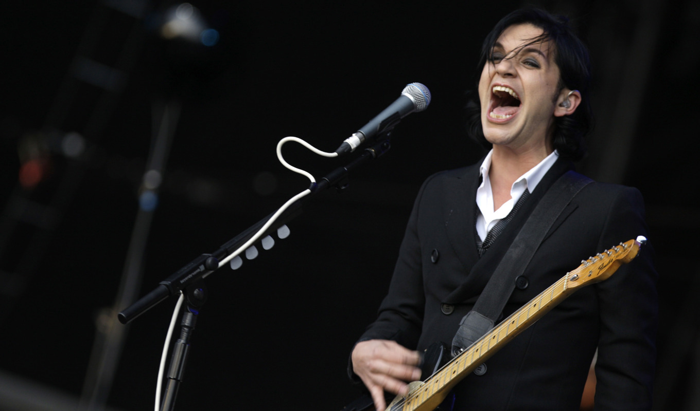 Brian Molko stäms av italienska premiärministern. Arkivbild. Foto: Joel Ryan/AP/TT