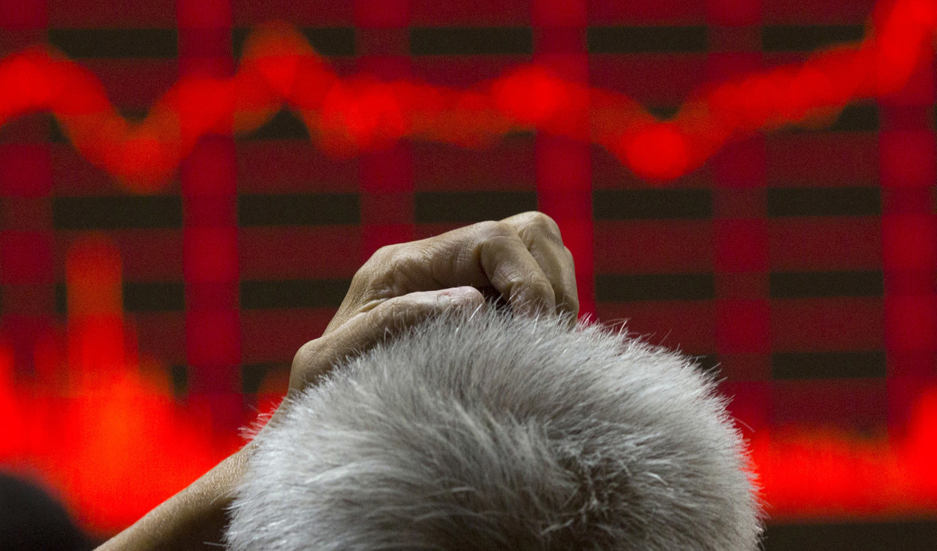 Asiens ledande börser pekade åt olika håll under den inledande tisdagshandeln. Arkivbild. Foto: Ng Han Guan/AP/TT
