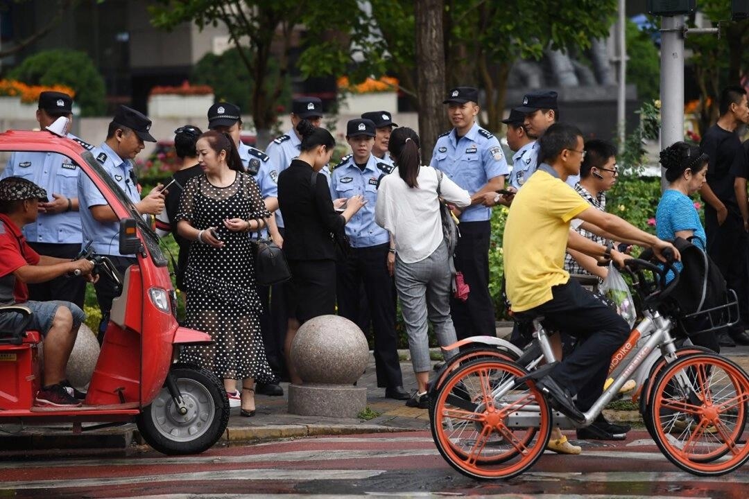 Poliskontroll i Peking. Foto: Greg Baker/AFP via Getty Images