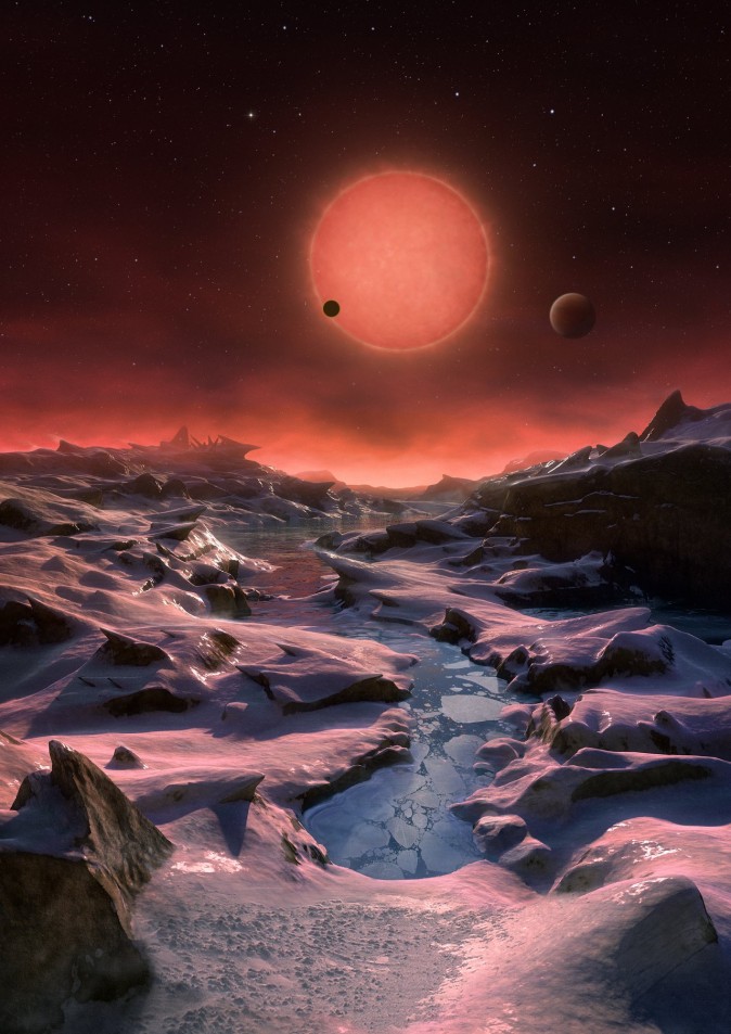 Illustrationen visar en tänkt vy av de tre planeterna som kretsar kring en ultrakall dvärgstjärna bara 40 ljusår från jorden. Systemet upptäcktes med det belgiska teleskopet TRAPPIST vid observatoriet La Silla i Chile. (ESO/M. Kornmesser)
